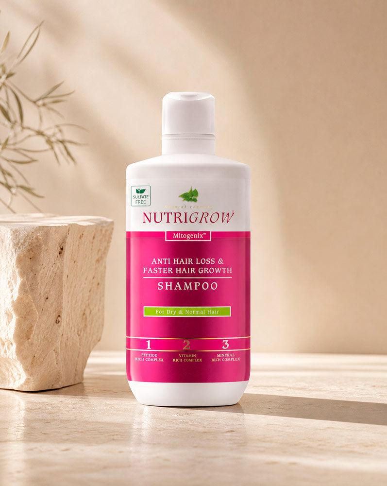 Nutrigrow Shampoo Anticaída, botella de 300 ml sobre travertino, vista frontal